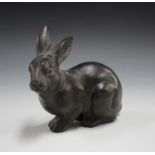 An early 20th century dark green patinated cast metal model of a rabbit, length 14cm.Buyer’s Premium