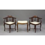 A near pair of Edwardian mahogany and inlaid corner armchairs, on cabriole legs, width 62cm,