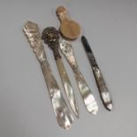 A 19th century mother-of-pearl and plated gilt metal paperknife, the filigree handle with applied