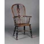 A 19th century Thames Valley yew and elm Windsor armchair with pierced splat back, the solid seat