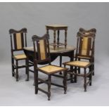 A set of four 19th century Carolean Revival oak dining chairs with carved decoration, the cane seats