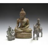 A South-east Asian green patinated bronze model of a seated Buddha, height 35cm, together with