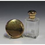 A 9ct gold mounted clear glass rectangular perfume bottle with screw top, London 1933 by