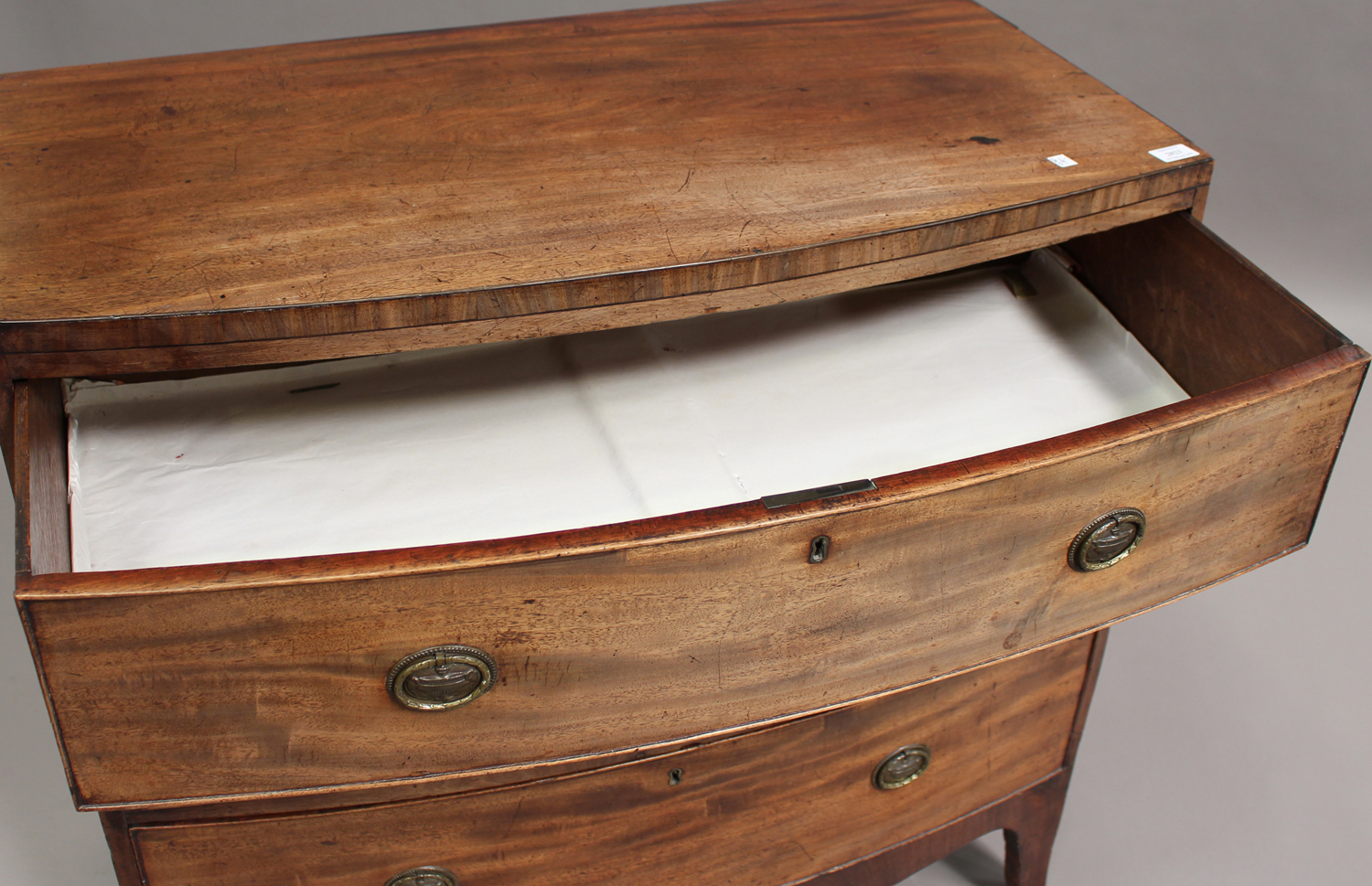 A Regency mahogany bowfront chest of three long drawers, on bracket feet, height 91cm, width 93cm, - Image 2 of 3