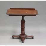 A Victorian mahogany adjustable reading stand, the rectangular top raised on a turned and fluted