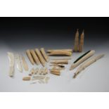 A group of early 20th century African carved ivory items, including fully-carved tusks, a carved