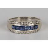 A white gold, sapphire and diamond half-hoop ring, mounted with a row of six square cut sapphires