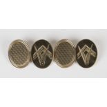 A pair of 9ct gold Masonic oval cufflinks, engine turned to one side and engraved with Masonic