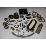 A large collection of costume jewellery, including necklaces, bangles, bracelets and brooches.