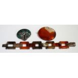 A vari-coloured agate bar link bracelet on a snap clasp, length 18cm, an oval agate brooch and a