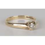 A 9ct gold and diamond single stone ring, mounted with a circular cut diamond, ring size approx O.