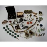 A large collection of costume jewellery, including necklaces, brooches and earrings.Buyer’s