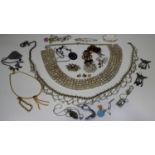 A collection of costume jewellery, including a colourless paste set belt, brooches, pendants and