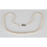 A single row necklace of graduated cultured pearls on a diamond set rectangular clasp, length