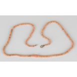 A single row necklace of graduated coral beads on a boltring clasp, length 46.5cm.Buyer’s Premium