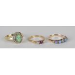 A gold and opal five stone ring, mounted with a row of circular opals, ring size approx R1/2, a