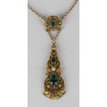 A gold, foil backed green and red paste and cultured pearl pendant necklace in a filigree and beaded