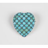 A gold backed and silver fronted diamond and turquoise brooch, designed as a heart, pavé set with