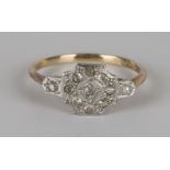 A gold, platinum and diamond cluster ring, mounted with nine cushion shaped diamonds between diamond