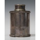 A late Victorian cylindrical tea caddy and cover with gadrooned rims, London 1891 by William Comyns,