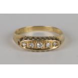 An 18ct gold and diamond five stone ring, mounted with a row of cushion shaped diamonds, Chester