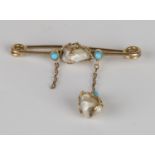 A gold, turquoise and freshwater pearl bar brooch, mounted with a freshwater pearl between two