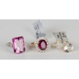 A 9ct white gold ring, claw set with a large cut cornered rectangular step cut pink tourmaline