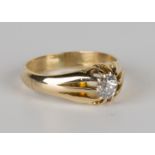 An 18ct gold and diamond single stone ring, claw set with a circular cut diamond, ring size approx