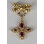 An 18ct gold, ruby and diamond brooch, the pendant drop mounted with four marquise shaped rubies,