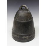 A Chinese brown patinated cast bronze bell, probably Qing dynasty, incised with a band of characters