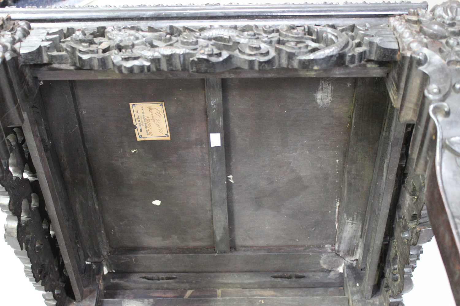 A Chinese carved hardwood stand, late 19th/early 20th century, the square panelled top with a carved - Image 5 of 7