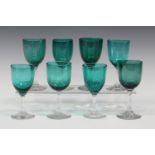 A matched set of eight Bristol green wine glasses, late 19th century, height of tallest 13.4cm.