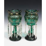 A pair of green glass lustres, late 19th/early 20th century, each bulbous shaped top enamelled and