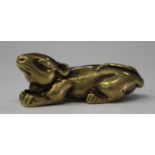 A Chinese gilt bronze figure of a squirrel, modelled in a recumbent pose, length 4.1cm.Buyer’s