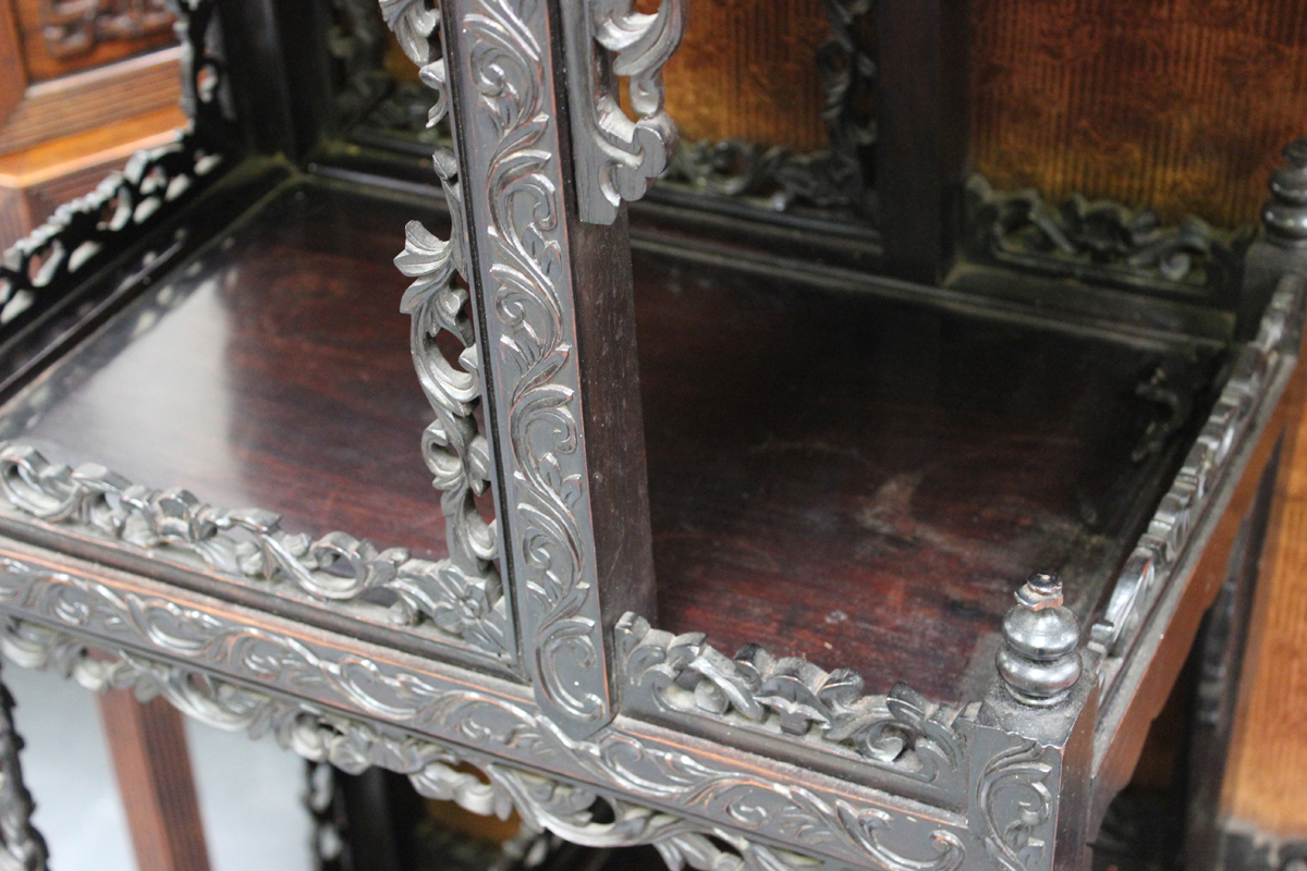 A Chinese carved hardwood display cabinet, late 19th/early 20th century, the rectangular panelled - Image 4 of 4