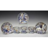 A set of three Chinese Imari porcelain cups and two saucers, Kangxi period, each painted and gilt