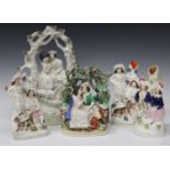 A mixed group of pottery and porcelain figures, late 19th and 20th century, including a