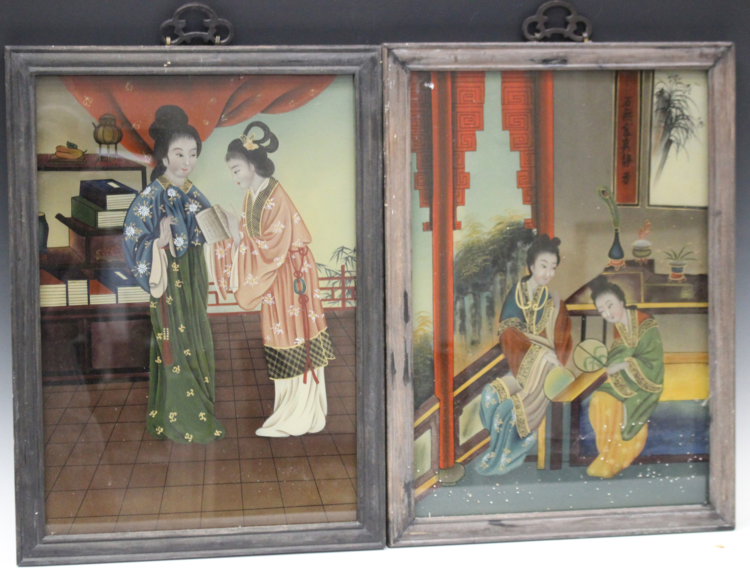 A pair of Chinese reverse paintings on glass, 20th century, each painted with two maidens in an