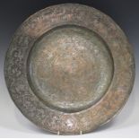 A Safavid tinned-copper circular dish, probably 18th century, the central well and wide rim engraved