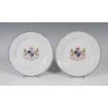 A pair of Chinese armorial porcelain plates, 19th century, each centre enamelled and gilt with a