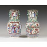 A pair of Chinese famille rose porcelain vases, mid-19th century, each shouldered body and flared