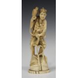A Japanese marine ivory okimono figure of a hawker, Meiji period, carved and pierced standing on a