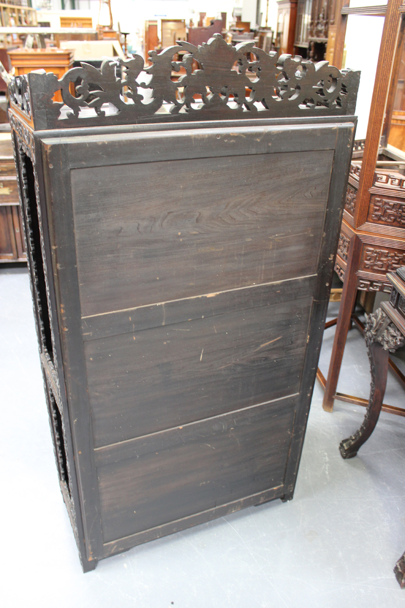 A Chinese carved hardwood display cabinet, late 19th/early 20th century, the rectangular panelled - Image 3 of 4