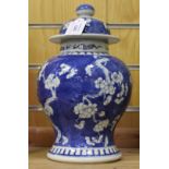 A Chinese blue and white porcelain jar and cover, mark of Kangxi but late 19th century, the baluster