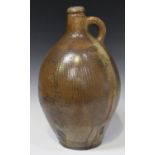 A large stoneware salt glazed Bellarmine style jug, late 17th/early 18th century, of typical pear