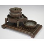 A Chinese brown patinated copper calligrapher's inkstand, 20th century, the rectangular base with