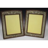 A pair of Chinese hardwood and jade photograph frames, early 20th century, each of slightly arched