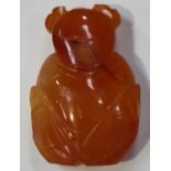 A Chinese agate pendant, 20th century, carved in the form of a boy, length 4cm.Buyer’s Premium 29.4%