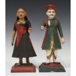 A pair of Indian painted and carved wood figures of a lady and gentleman, late 19th century, each