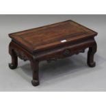 A Chinese hardwood occasional table, late 19th century, the rectangular panelled top above a